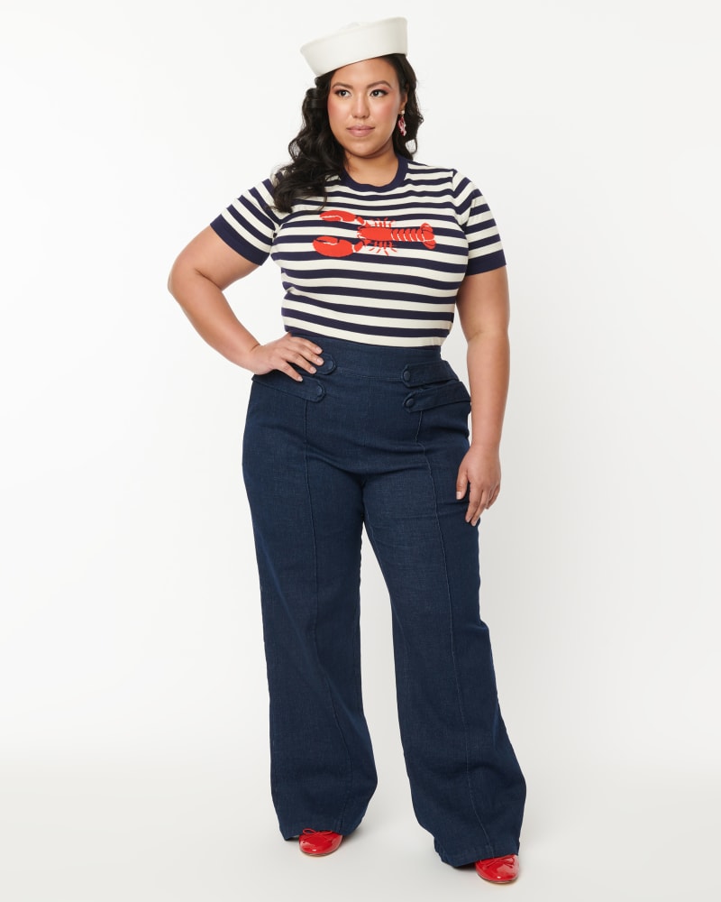 Front of a model wearing a size 1X Unique Vintage Denim High Waist Wide Leg Tab Pants in Blue Denim by Unique Vintage. | dia_product_style_image_id:333375
